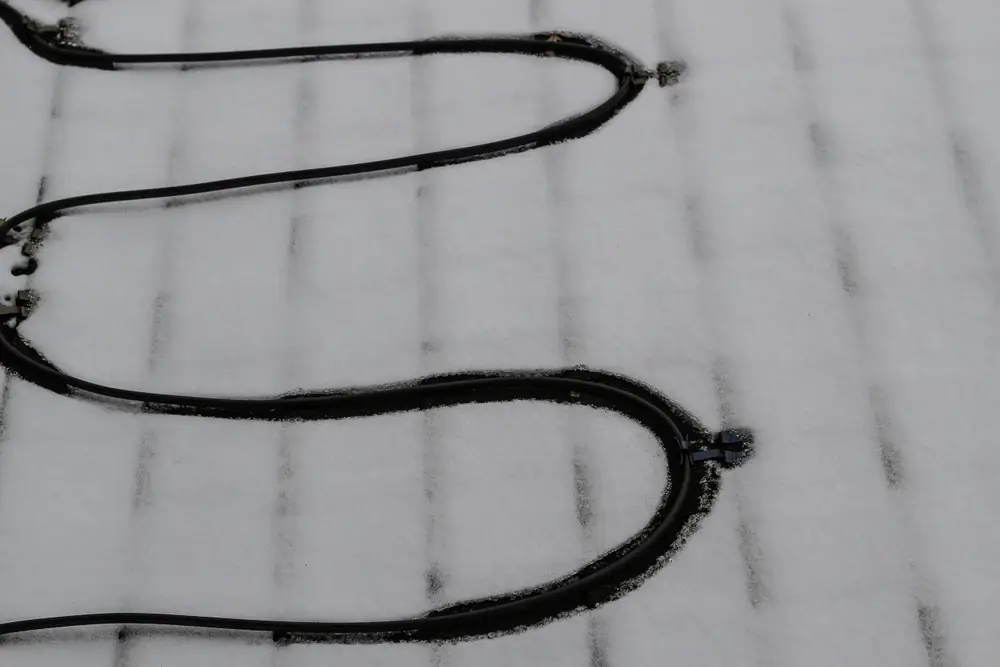 Heat tape system on snowy roof